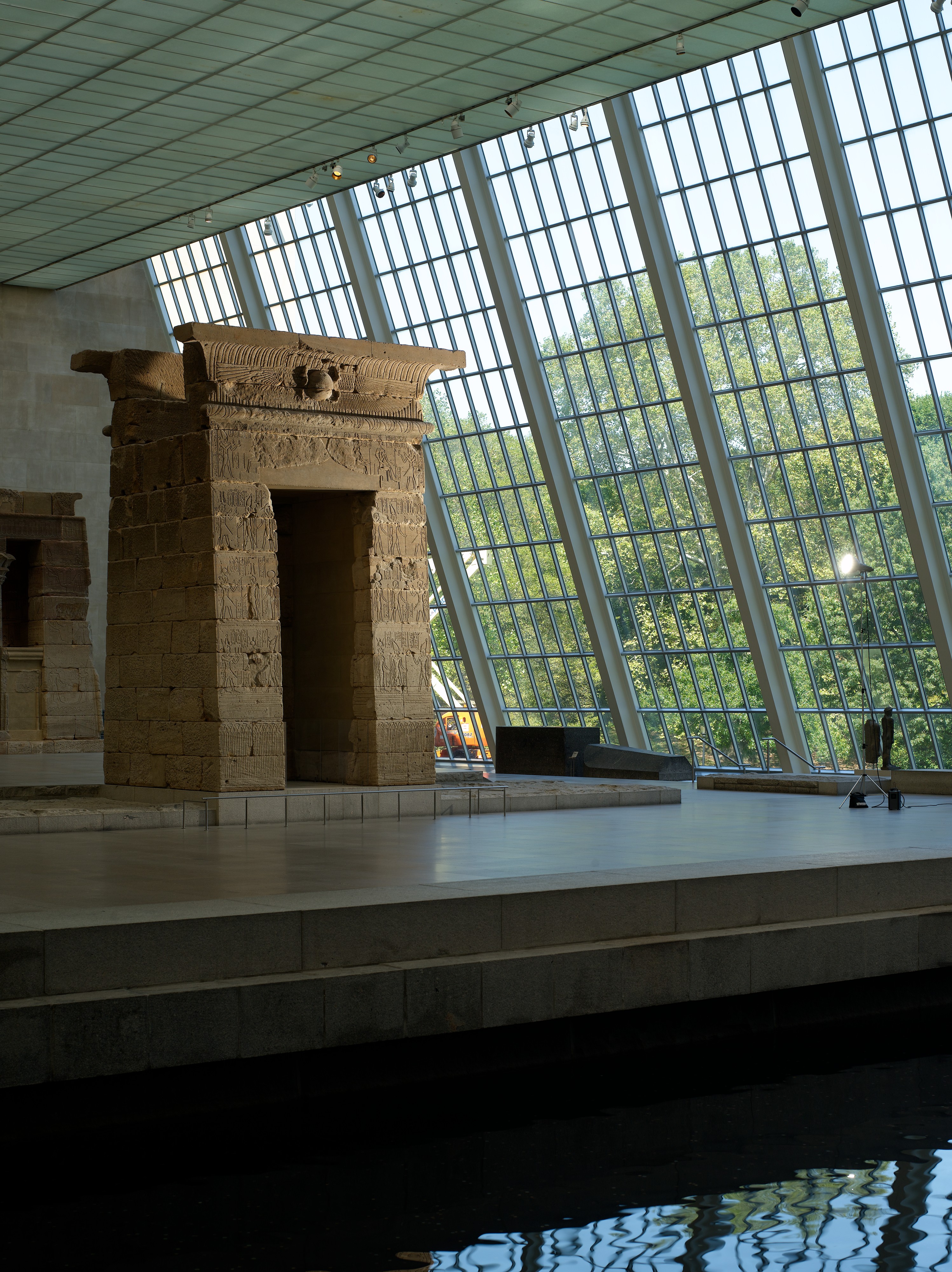 Closer view through the Temple of Dendur gateway toward the temple building, showing carved sandstone walls.
